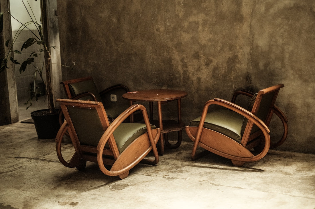 a couple of chairs sitting next to a table