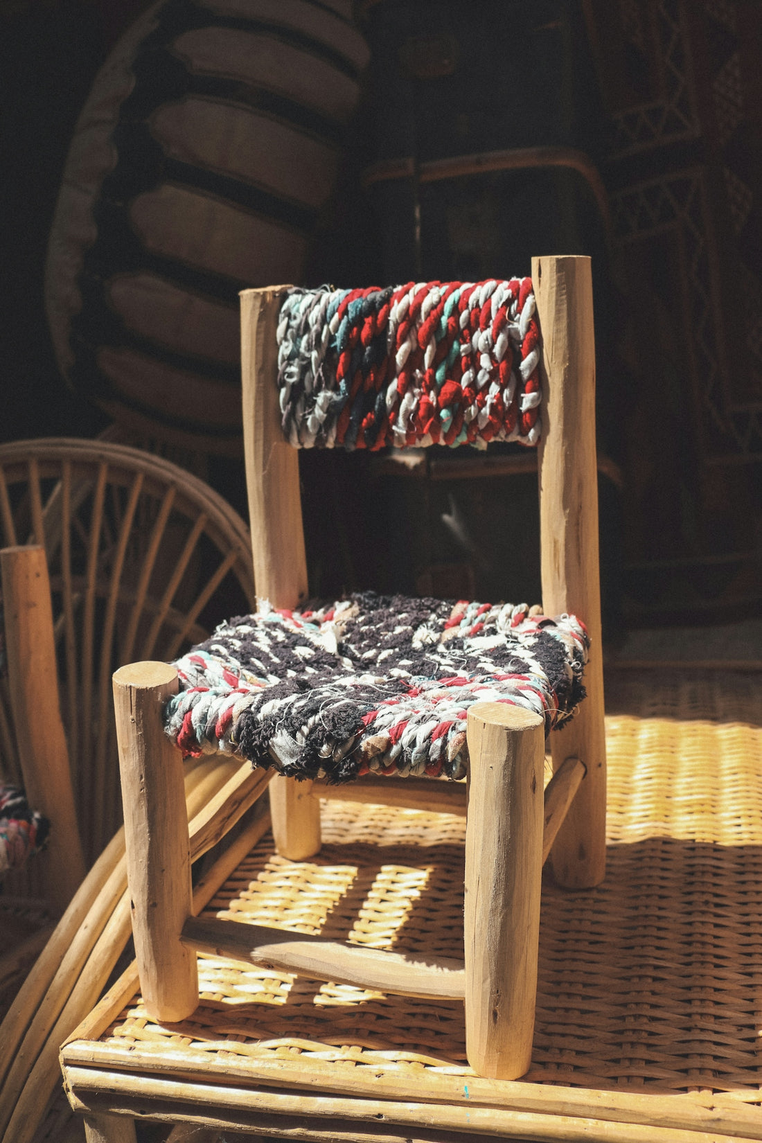 a chair made out of wood and rope