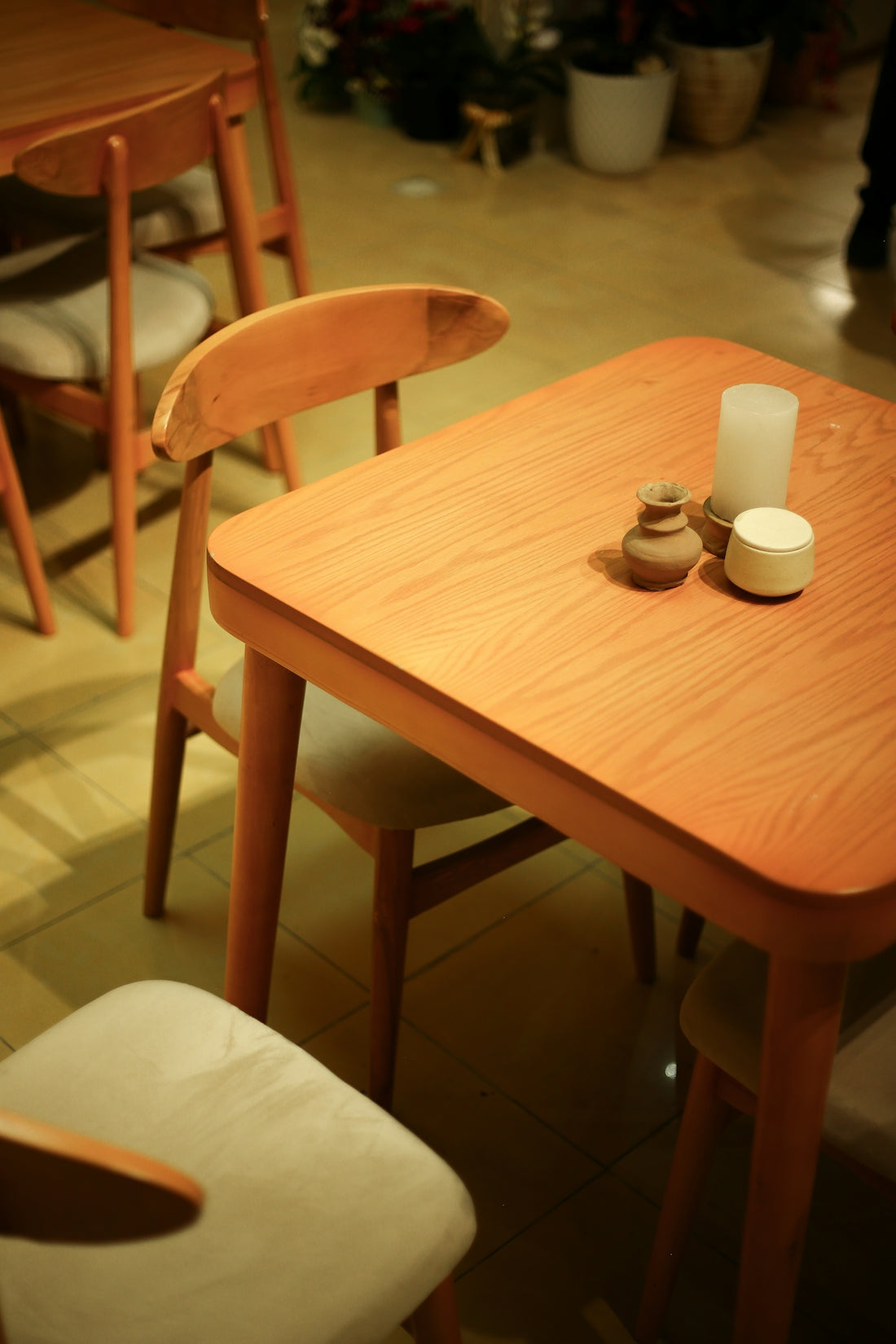 A wooden table and chairs in a room