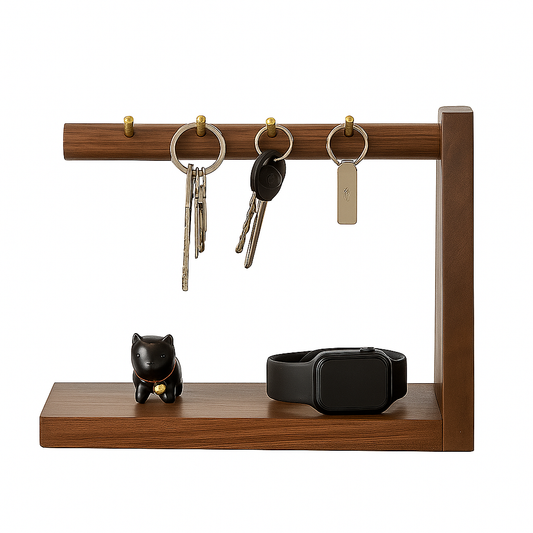 Wooden key holder with keys, a watch, and a small figurine on a white background